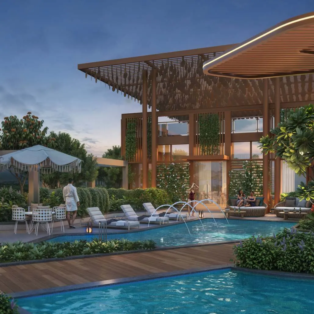 Poolside deck and pergola clubhouse at dusk